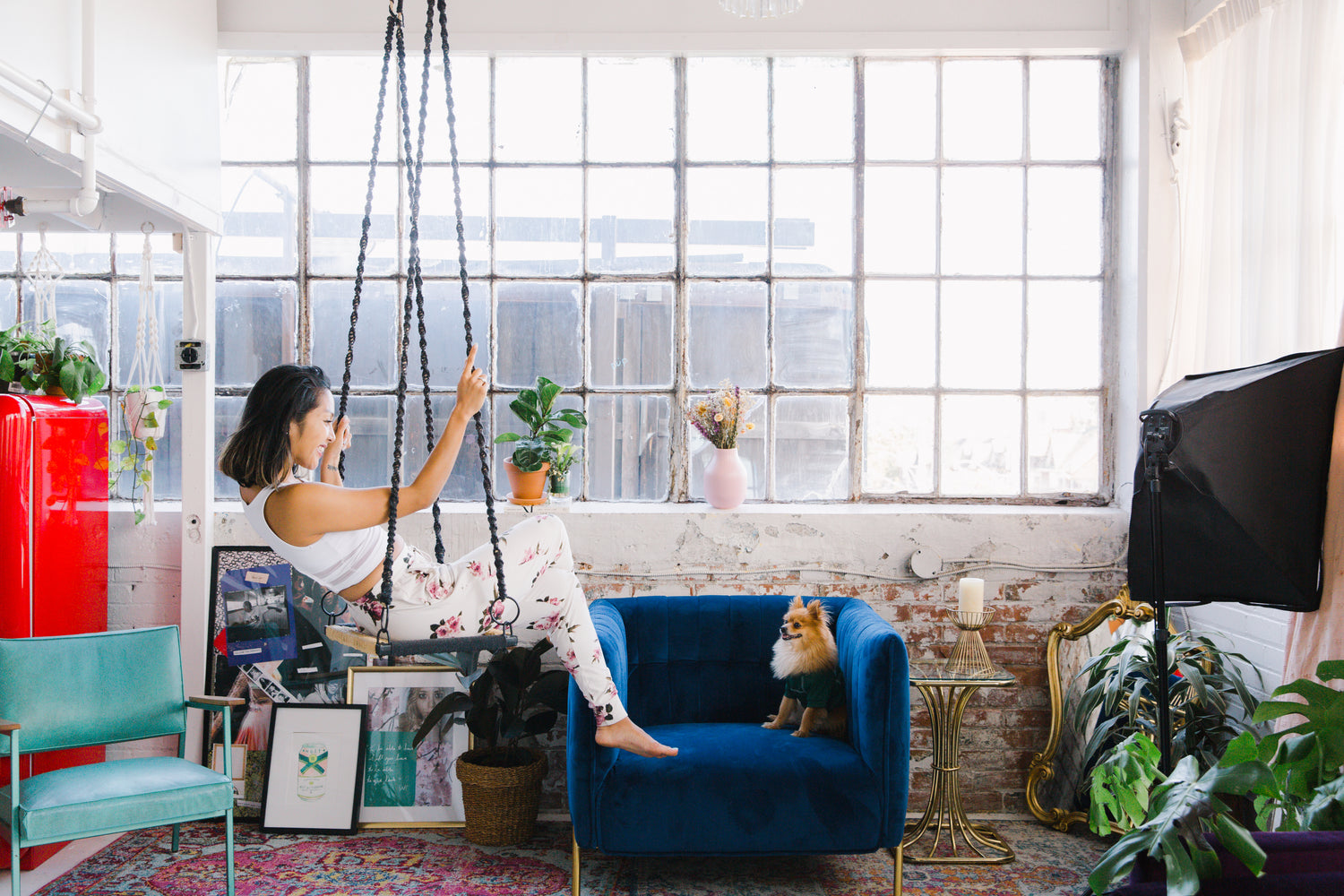 Women swinging in the living room with decorated with Radyanz home decor items